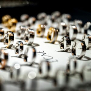 An exquisite display of luxury rings elegantly presented on a store counter, showcasing fine craftsmanship.